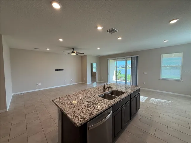 a kitchen with a sink and a window