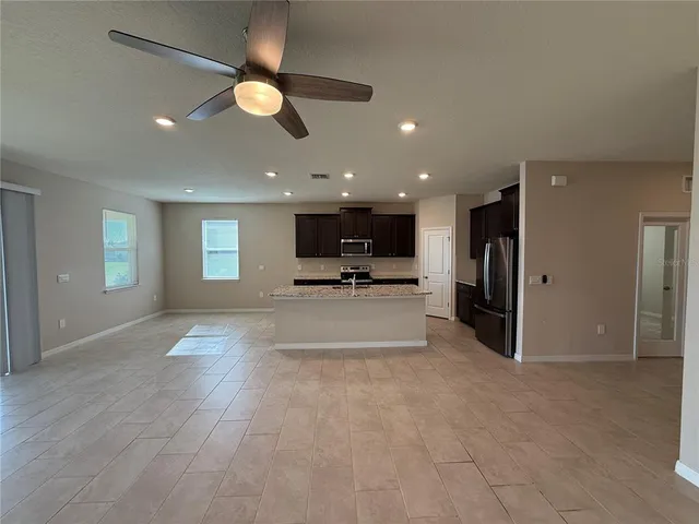 a view of a hallway with wooden shelves