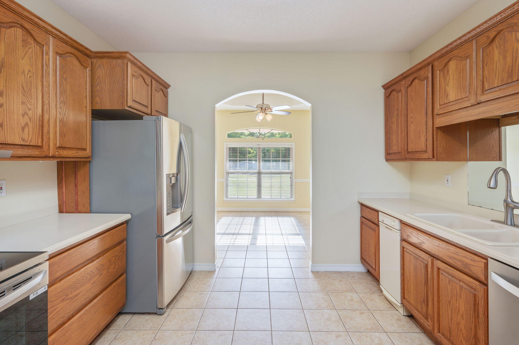 5552 Frontier Drive Crestview, FL 32536 - Photo 15 of 50 a kitchen with stainless steel appliances granite countertop a refrigerator and a stove top oven
