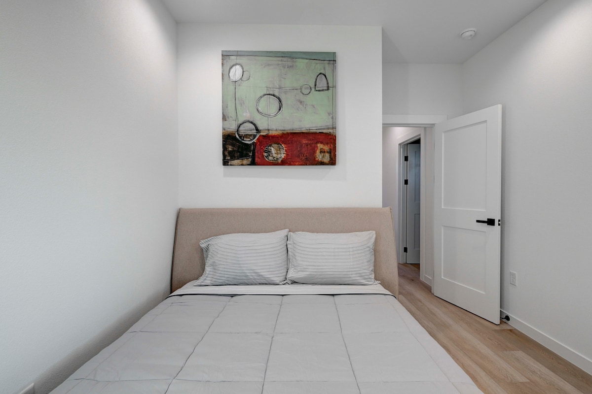 2220 Yellow Jacket Lane, Unit 1 Austin, TX 78741 - Photo 21 of 35 Hardwood flooring and recessed lighting define this cozy, well-lit bedroom.