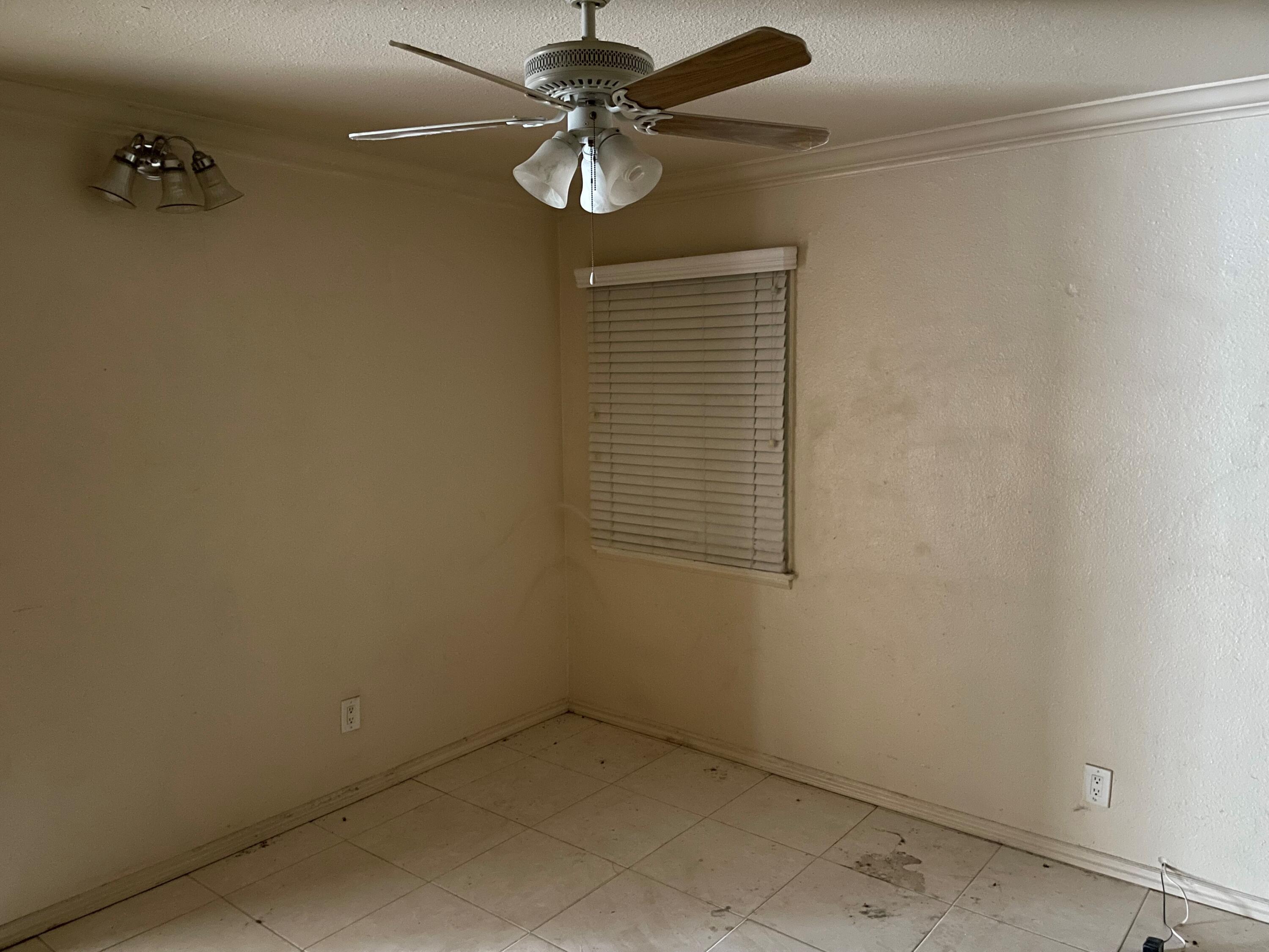 382 Iowa Avenue Riverside, CA 92507 - Photo 11 of 26 an empty room with a chandelier fan
