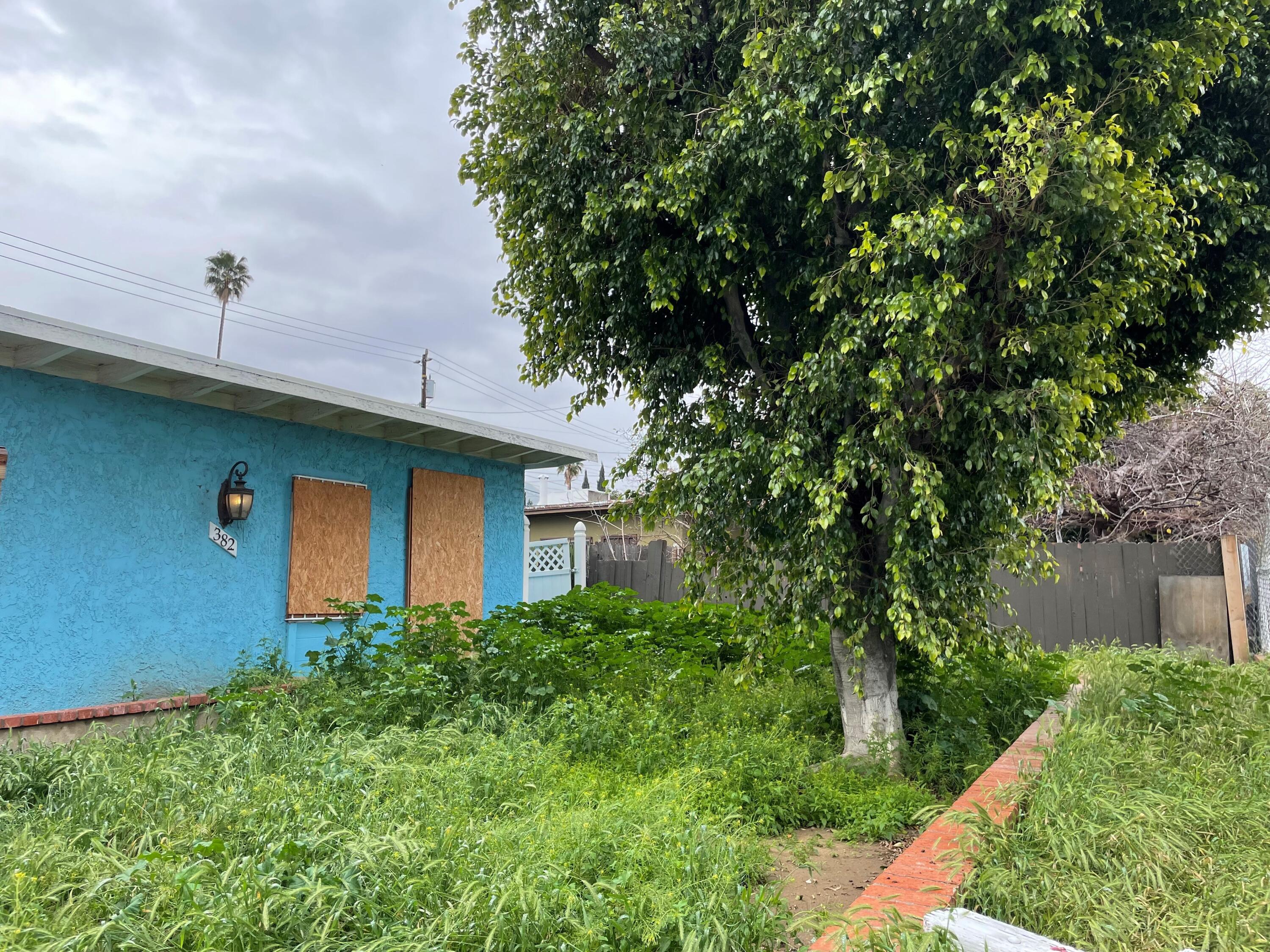 382 Iowa Avenue Riverside, CA 92507 - Photo 15 of 26 a front view of a house with a yard