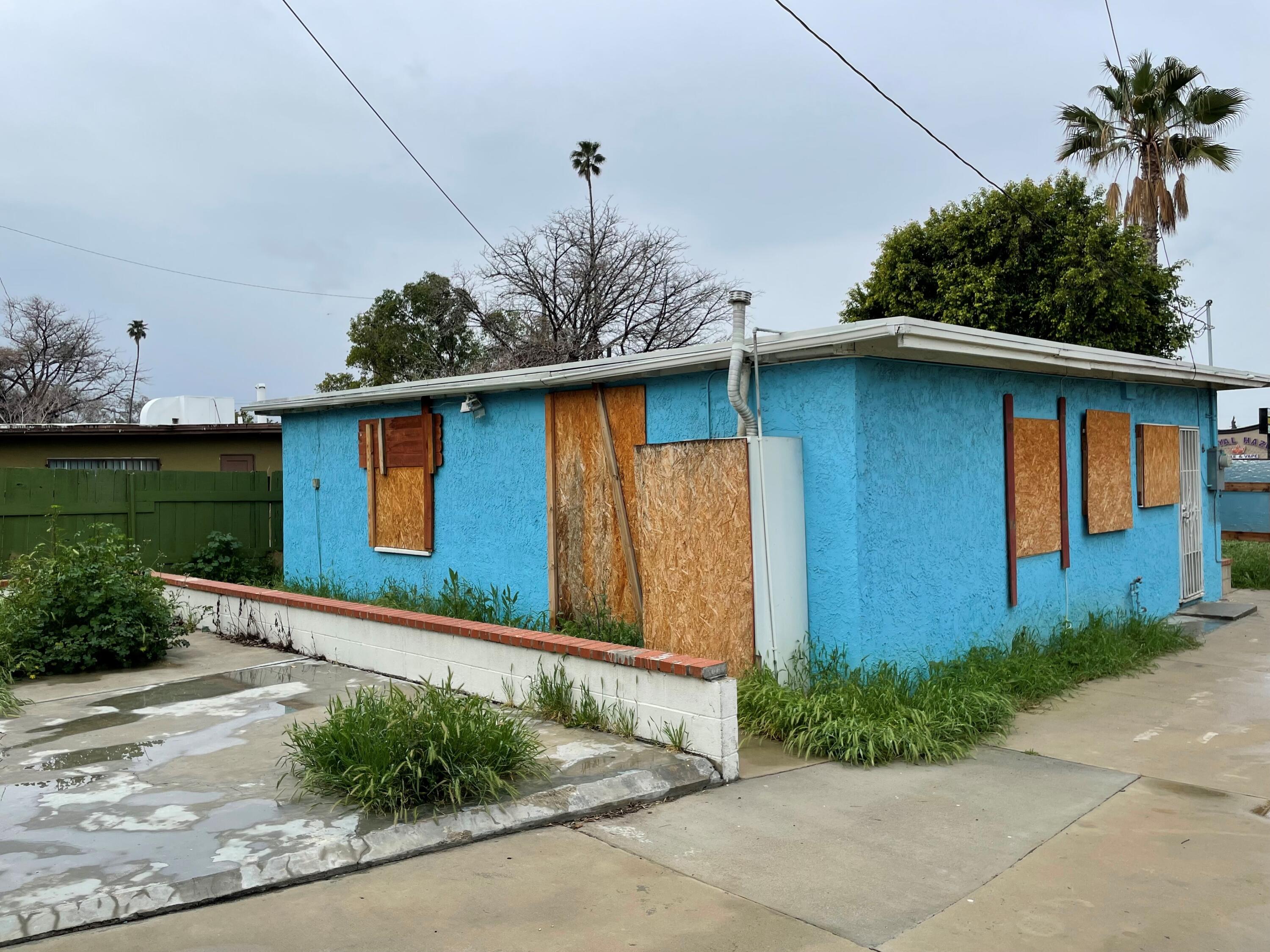 382 Iowa Avenue Riverside, CA 92507 - Photo 25 of 26 a front view of a house with garden