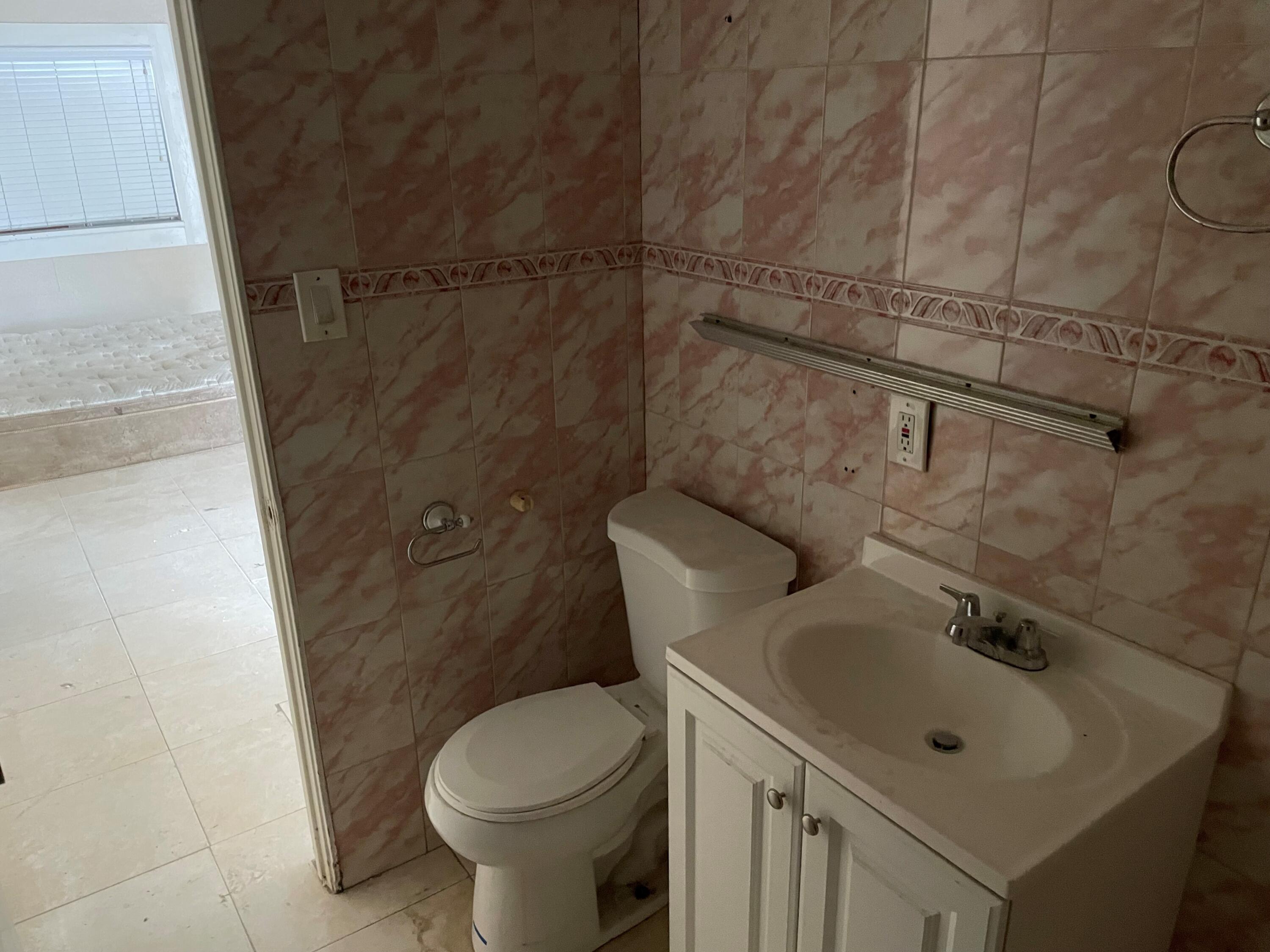 382 Iowa Avenue Riverside, CA 92507 - Photo 5 of 26 a bathroom with a sink toilet and shower