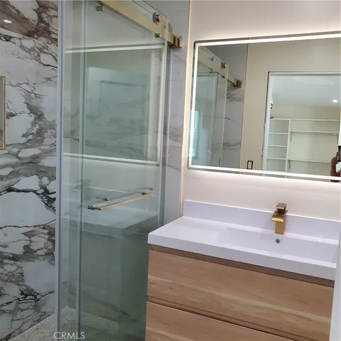 a bathroom with a sink and mirror