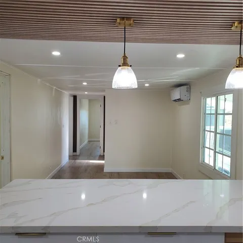 a view of a hallway with a chandelier