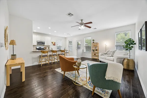 a living room with furniture a fireplace and a table