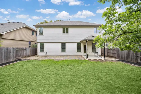 a view of a patio with a yard