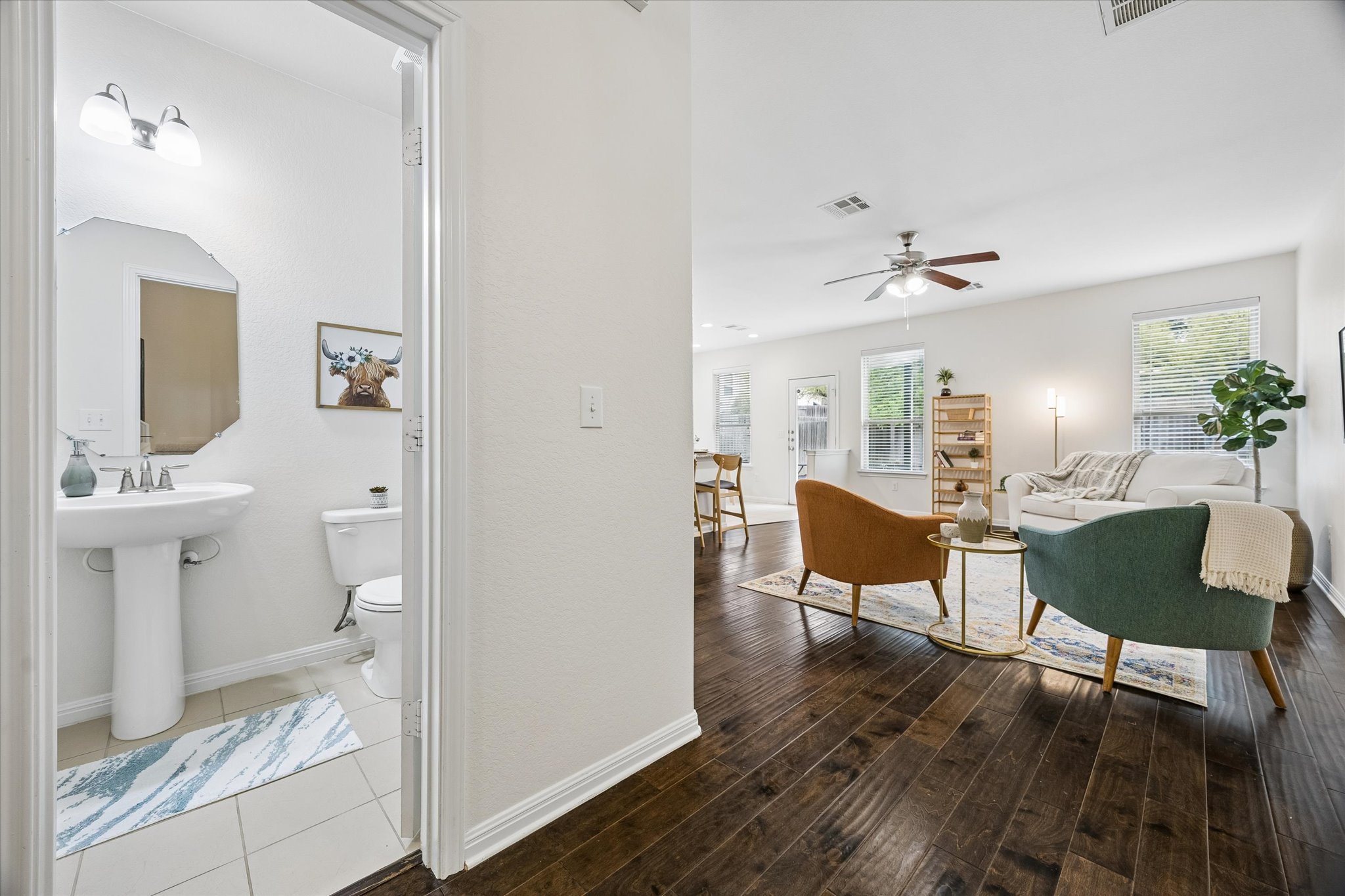 192 Santa Maria Street Georgetown, TX 78628 - Photo 6 of 27 Living room and half bath downstairs