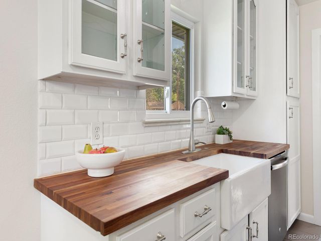 a bathroom with a sink and a window