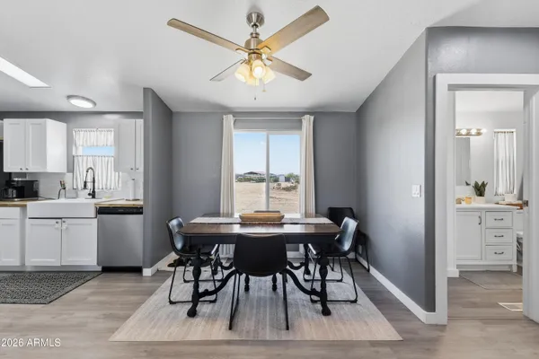 a view of a dining room with furniture and window