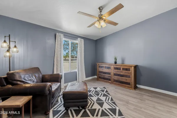 a bedroom with furniture and a chandelier