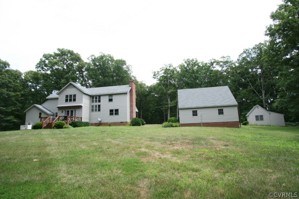 1624 Shallow Well Road Manakin-Sabot, VA 23103 - Photo 20 of 24 a house with green field in front of it
