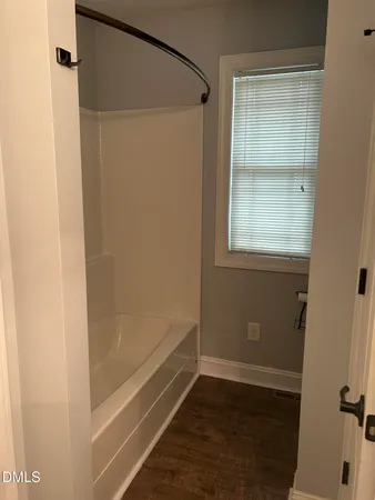 a bathroom with a glass shower door