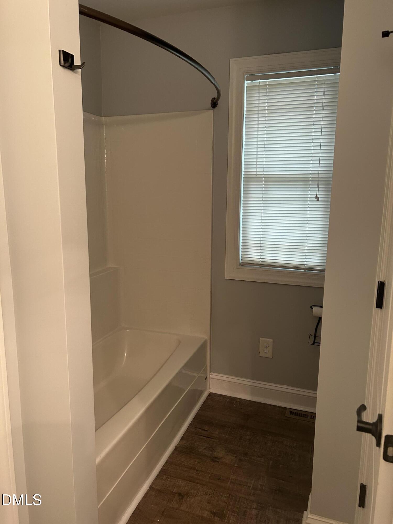 3105 Tump Wilkins Road Stem, NC 27581 - Photo 13 of 30 a bathroom with a glass shower door