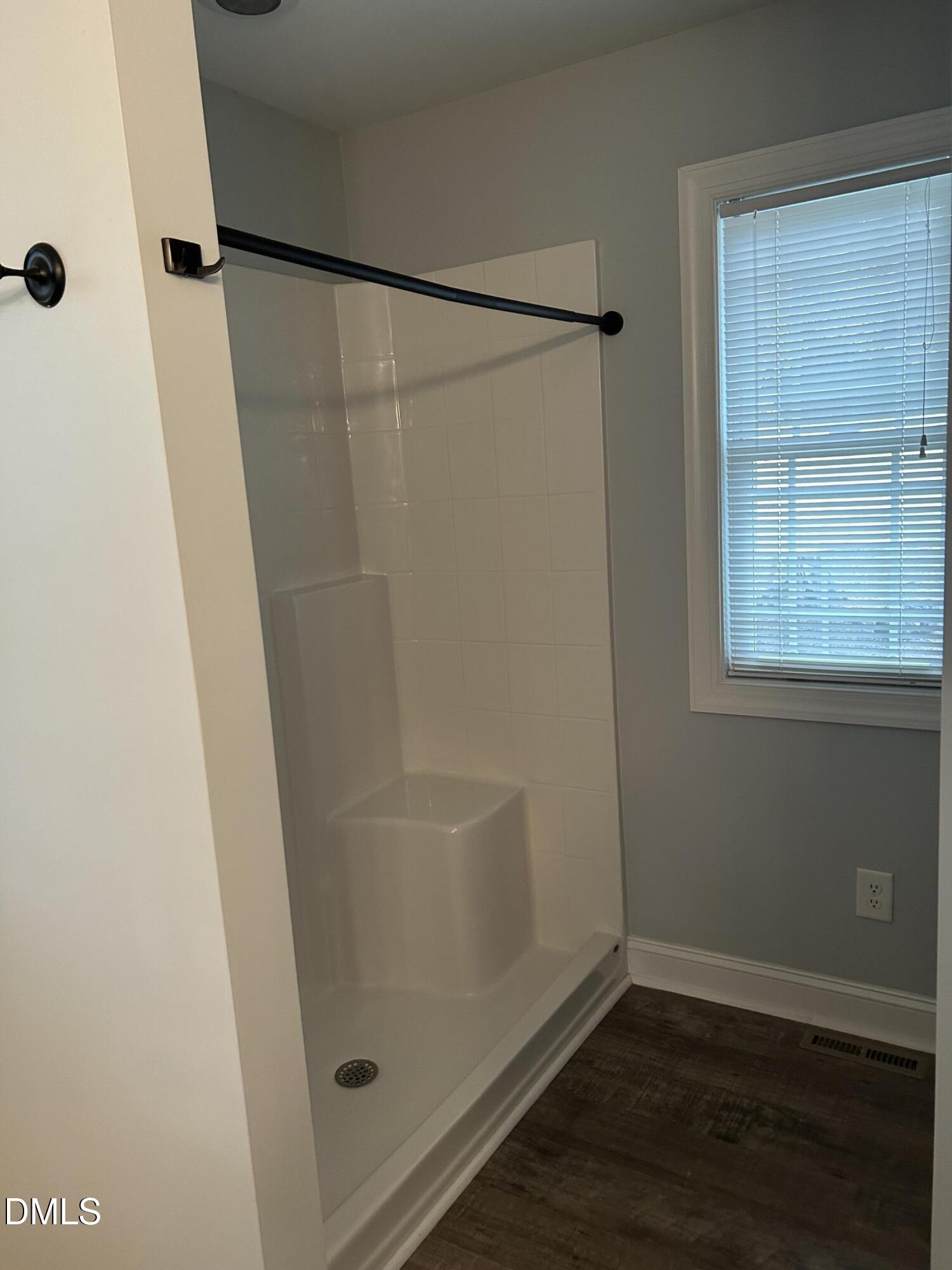 3105 Tump Wilkins Road Stem, NC 27581 - Photo 20 of 30 a bathroom with a glass shower door