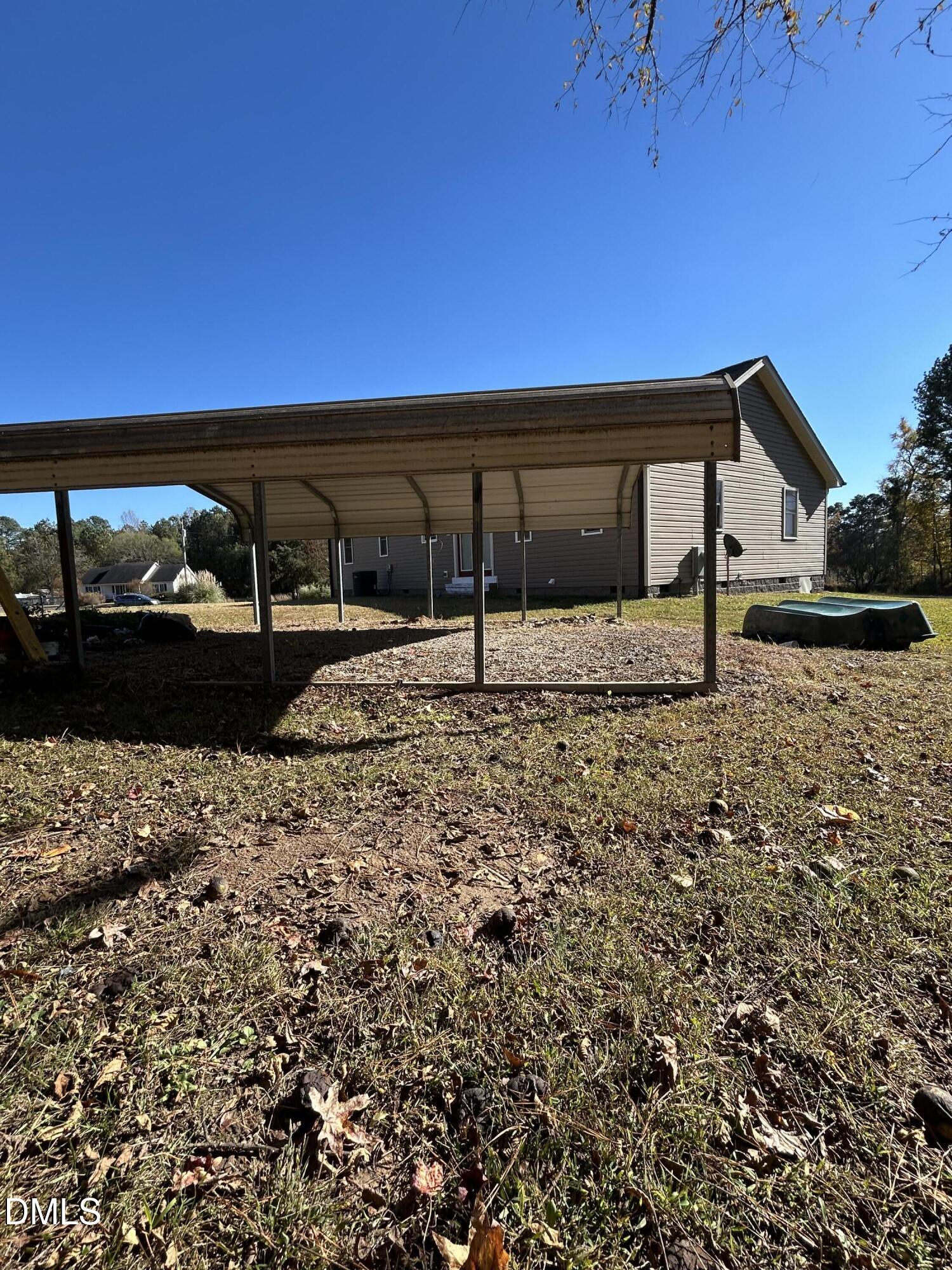 3105 Tump Wilkins Road Stem, NC 27581 - Photo 26 of 30 a house view with a backyard space