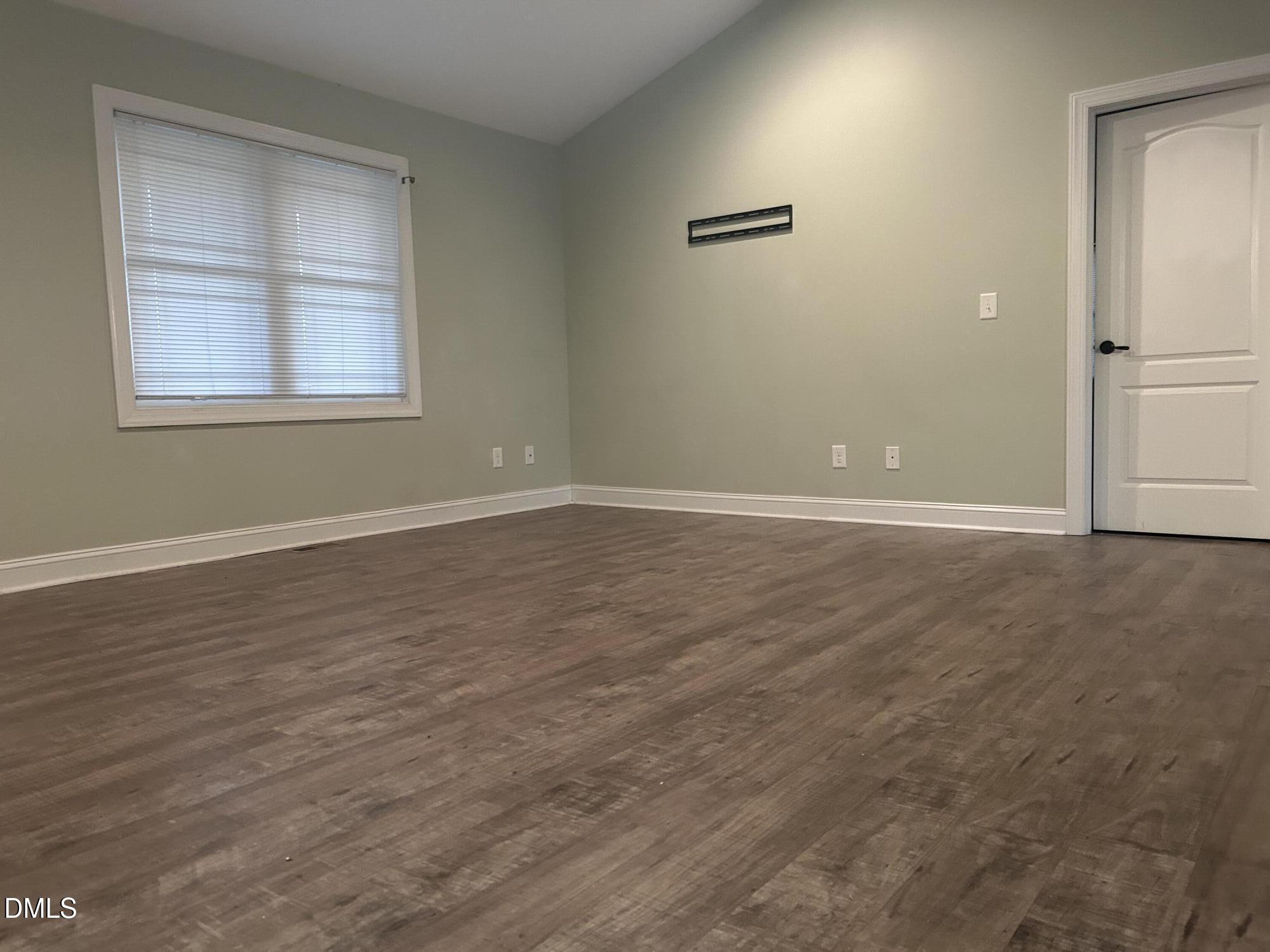 3105 Tump Wilkins Road Stem, NC 27581 - Photo 10 of 30 an empty room with windows and closet