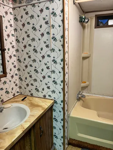 a bathroom with a sink and a bathtub