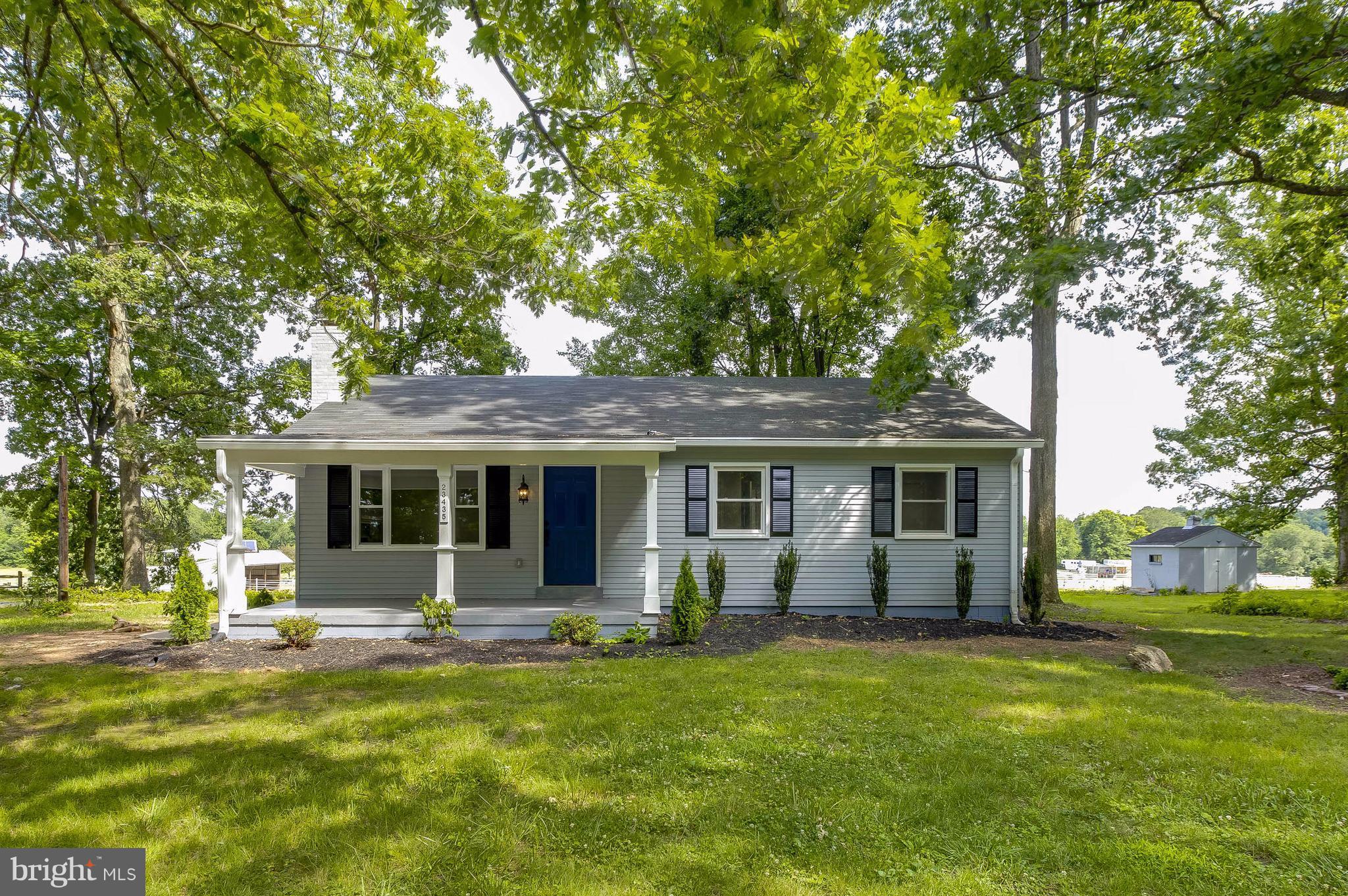 23435 Peach Tree Road Clarksburg, MD 20871 - Photo 1 of 26 a front view of house with yard and green space