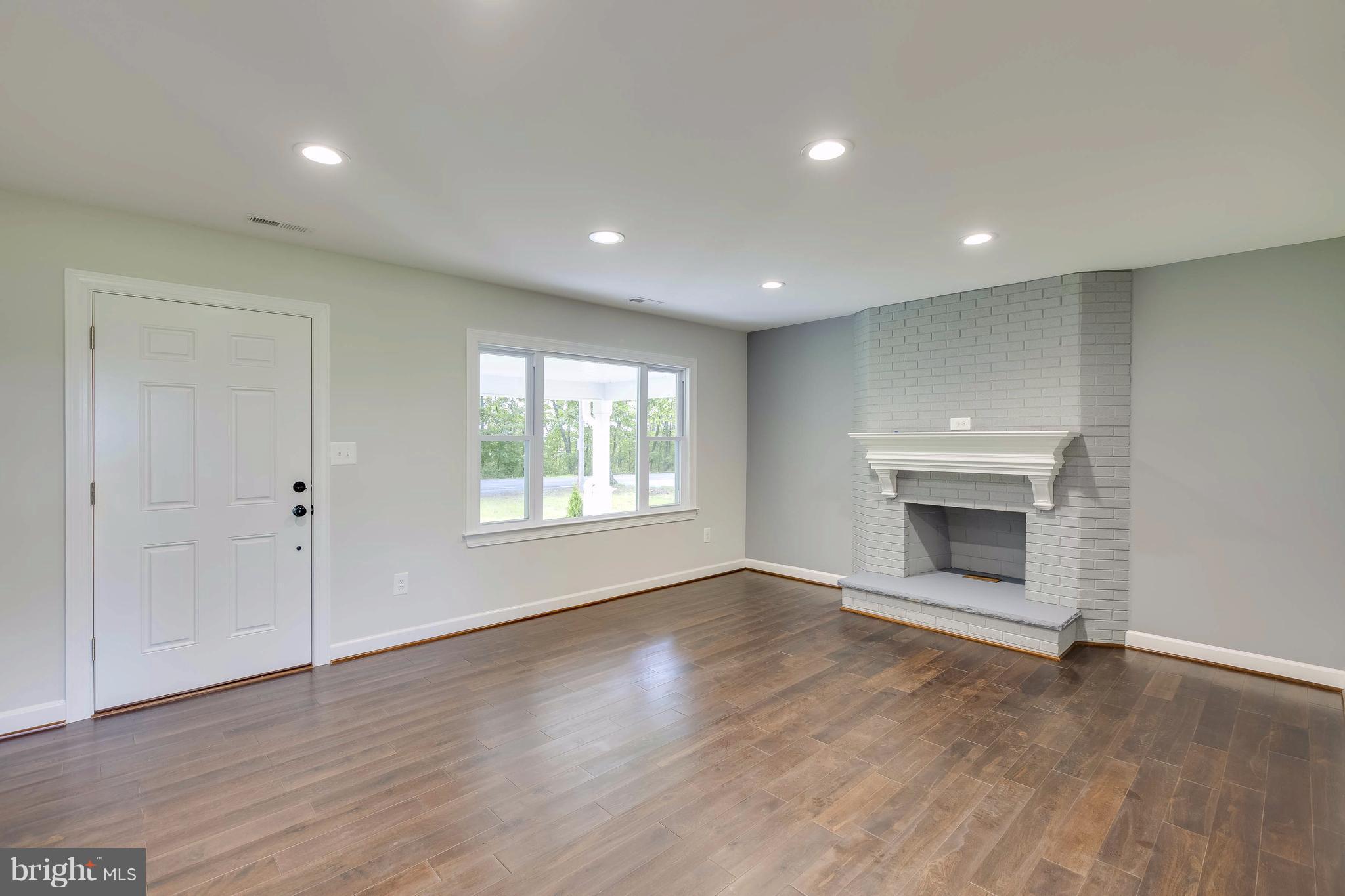 23435 Peach Tree Road Clarksburg, MD 20871 - Photo 4 of 26 wooden floor in an empty room with a window