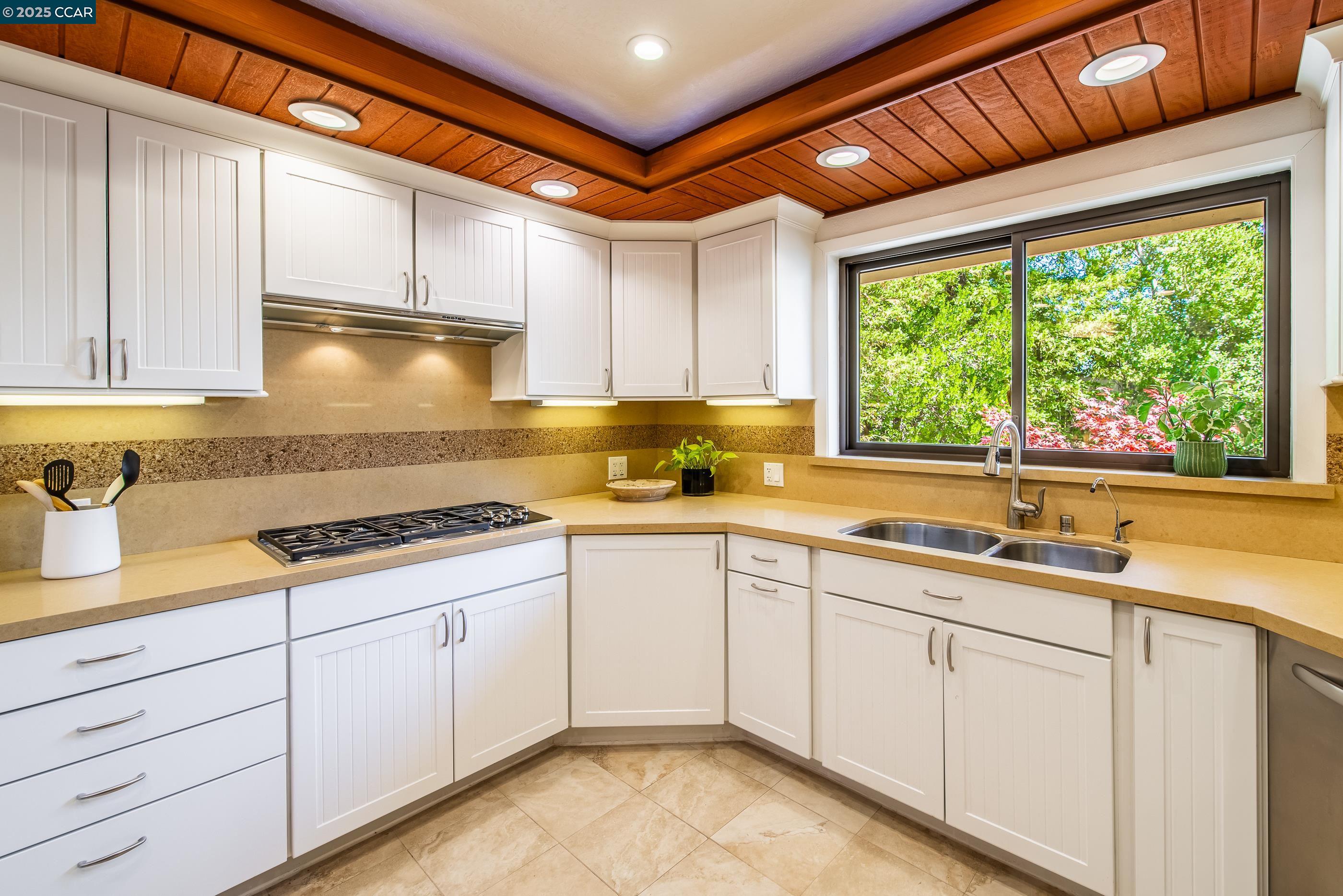 220 Devonshire Court Pleasant Hill, CA 94523 - Photo 19 of 47 a kitchen with granite countertop a sink stainless steel appliances and cabinets