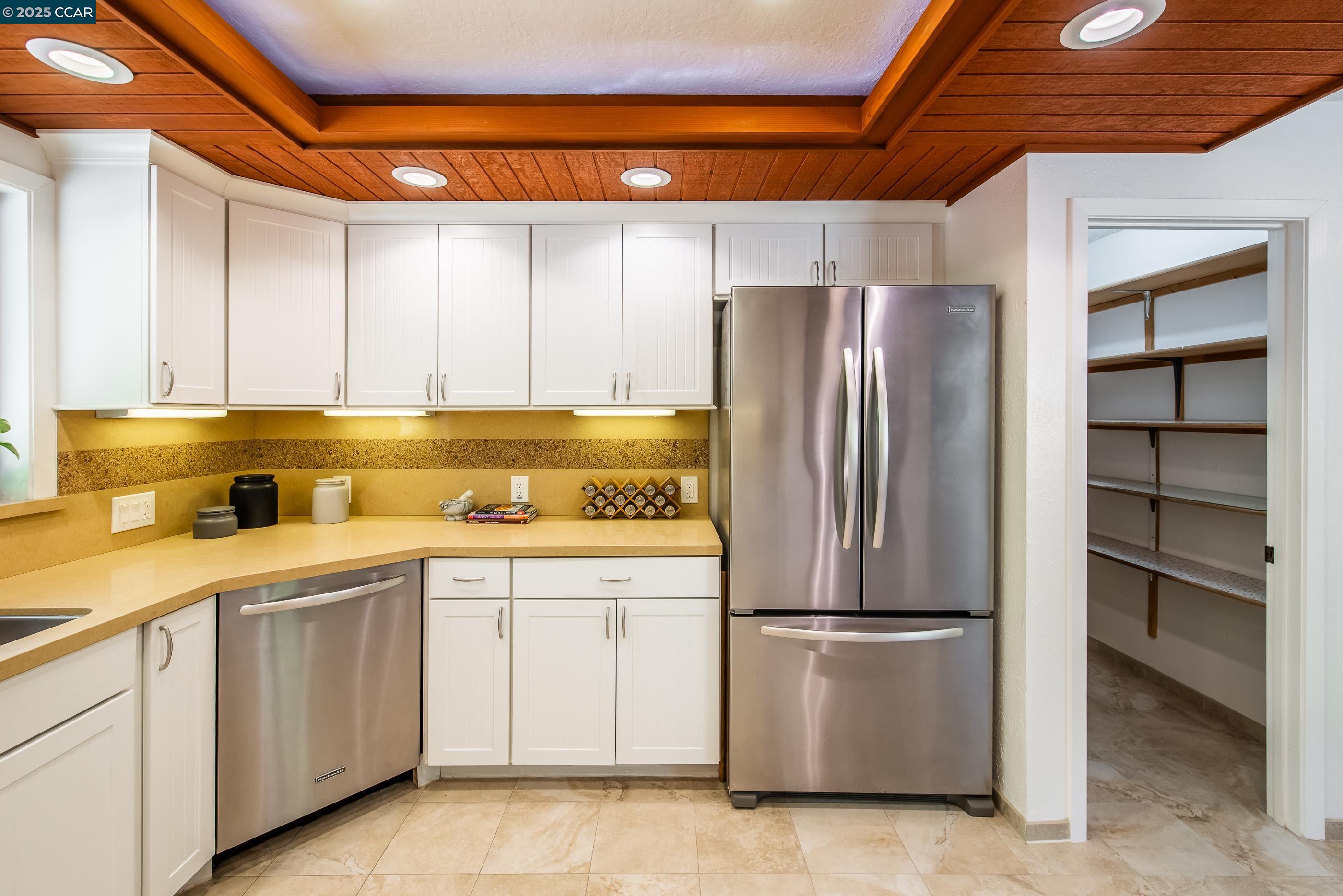 220 Devonshire Court Pleasant Hill, CA 94523 - Photo 20 of 47 a kitchen with a refrigerator sink and cabinets