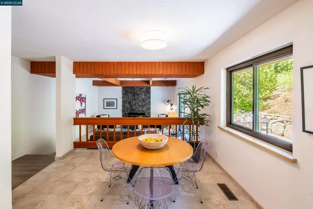 a living room with furniture fireplace and flat screen tv