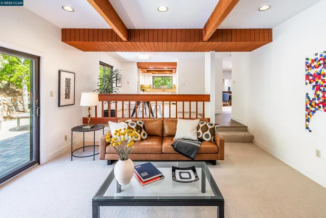 a room with furniture and floor to ceiling window