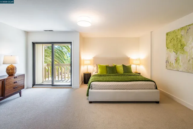 a spacious bedroom with a bed and window