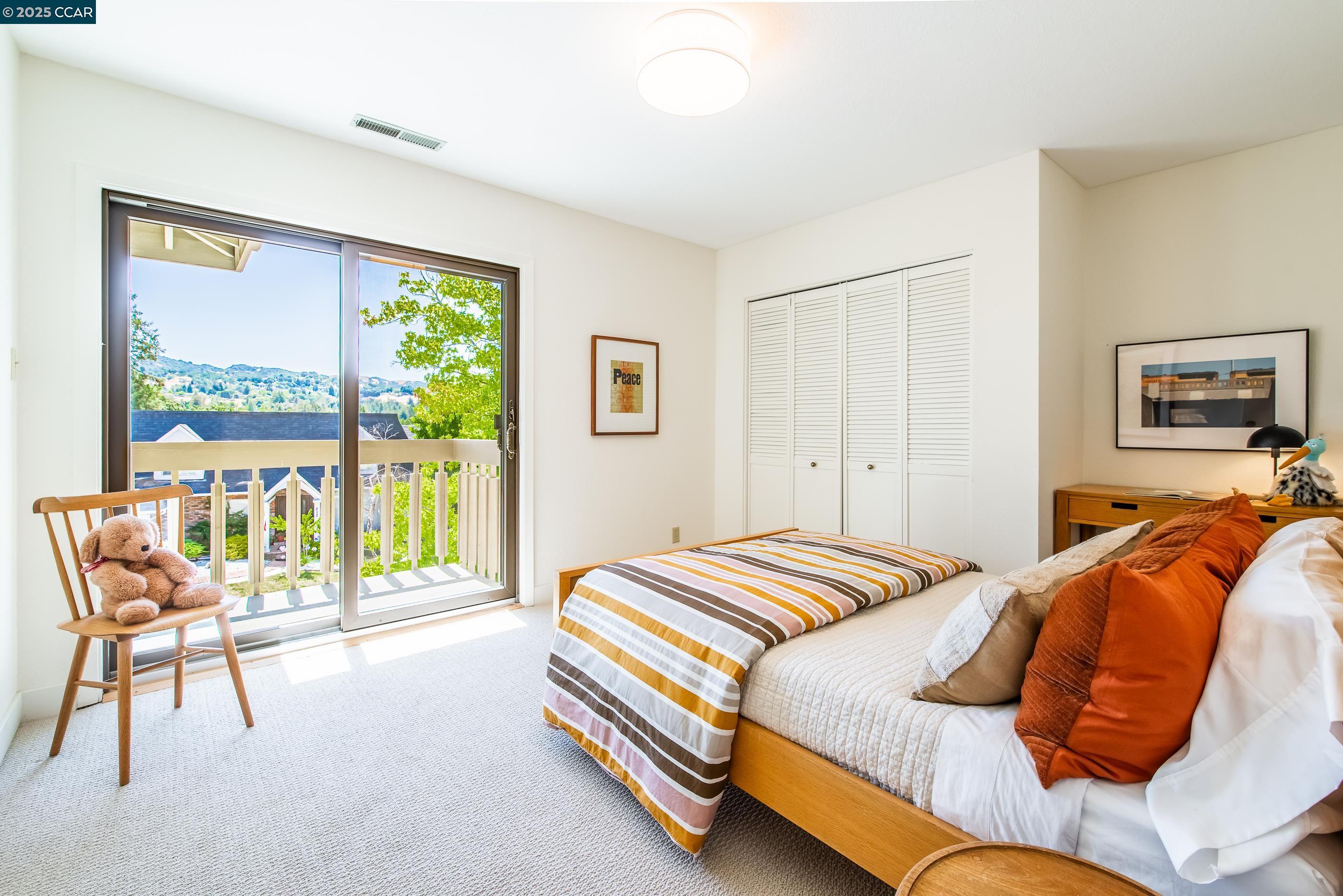 220 Devonshire Court Pleasant Hill, CA 94523 - Photo 32 of 47 a bedroom with a bed and a window