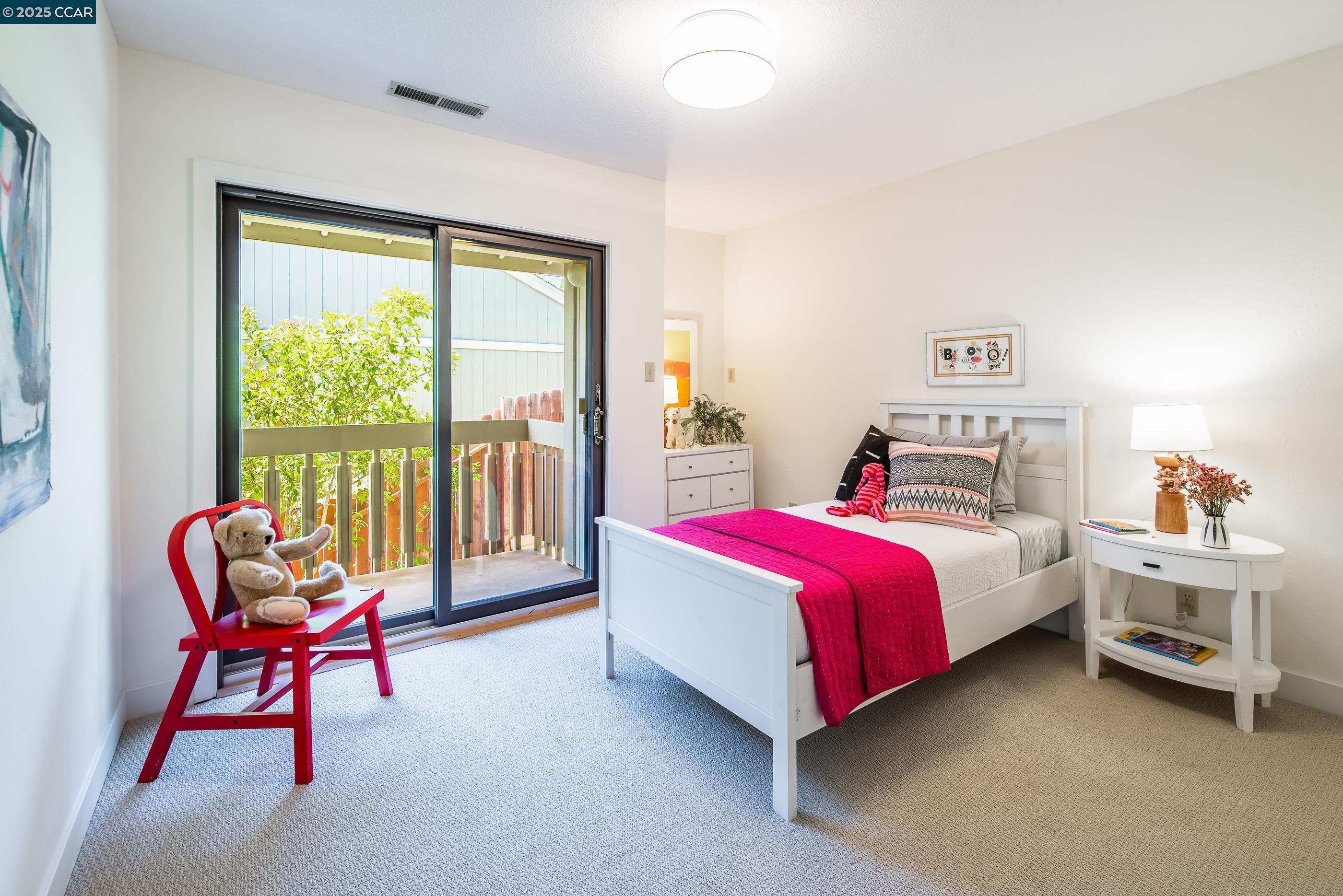 220 Devonshire Court Pleasant Hill, CA 94523 - Photo 35 of 47 a bedroom with a bed and a chair