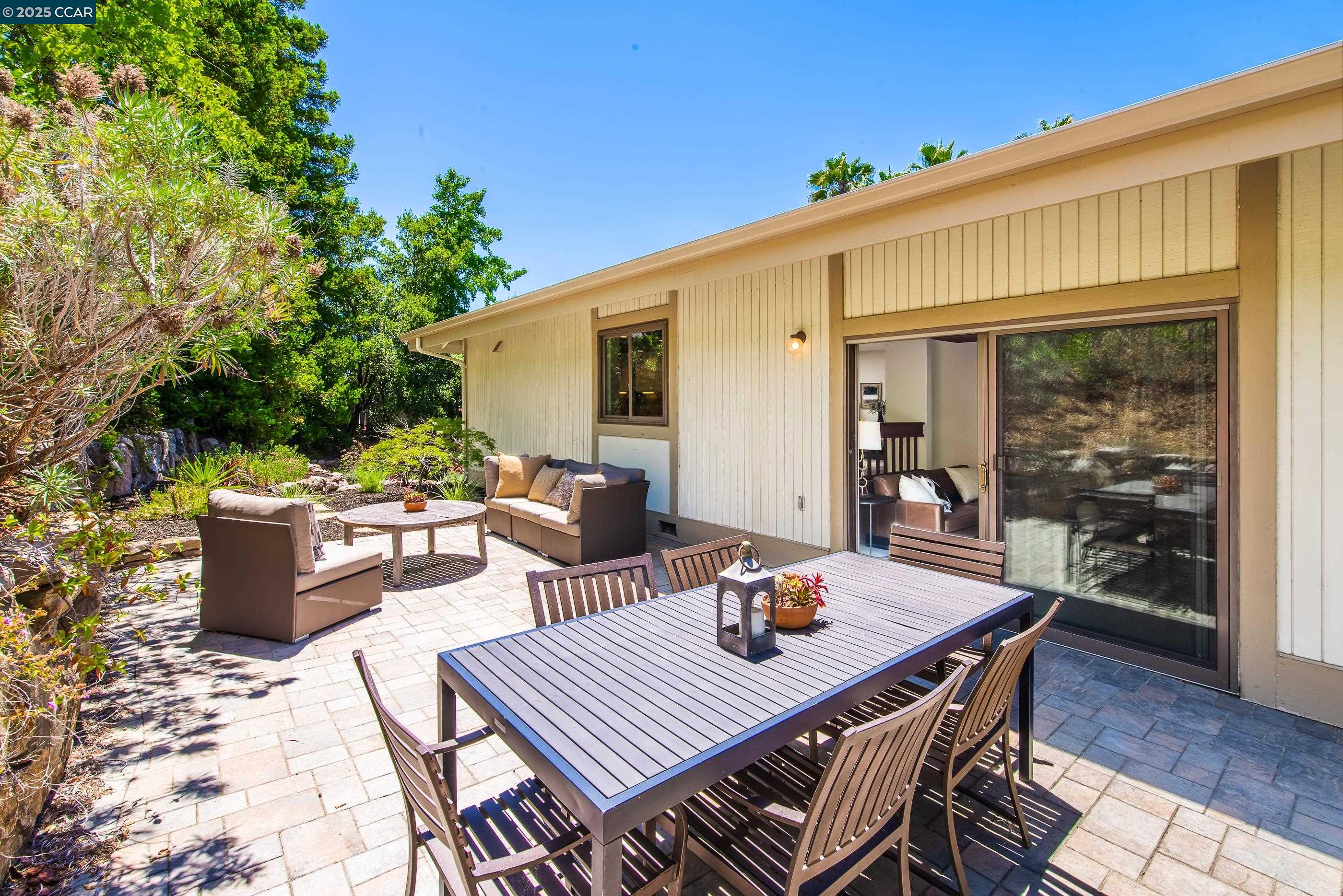 220 Devonshire Court Pleasant Hill, CA 94523 - Photo 38 of 47 a view of a patio with table and chairs and potted plants
