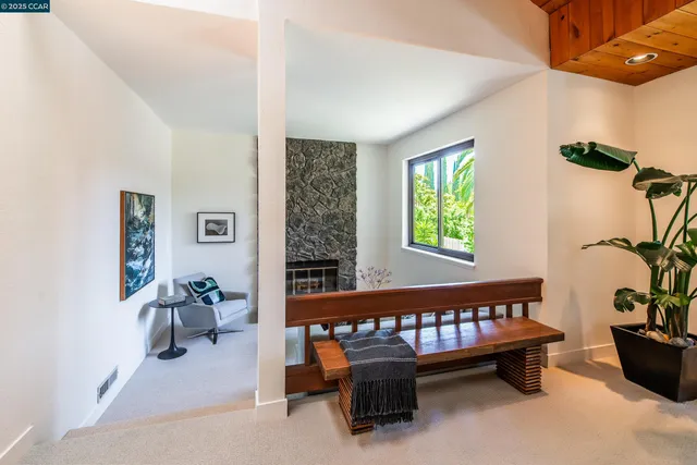 a bedroom with furniture and a window