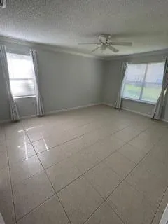 a view of an empty room and a windows