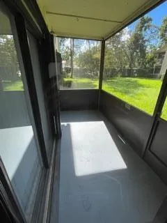 a view of an empty room with a large window