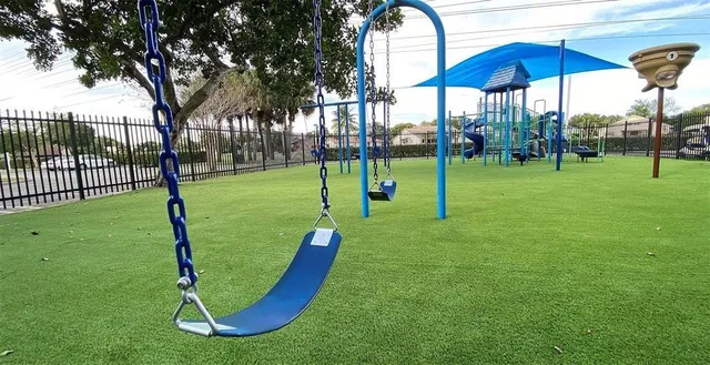 a view of a park with swings