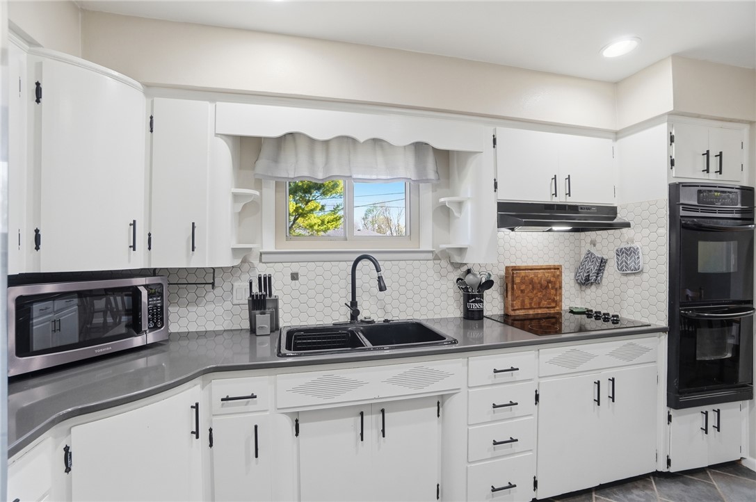1325 Chelsea Road Troy, OH 45373 - Photo 15 of 42 This bright kitchen features modern appliances and ample counter space for culinary endeavors.