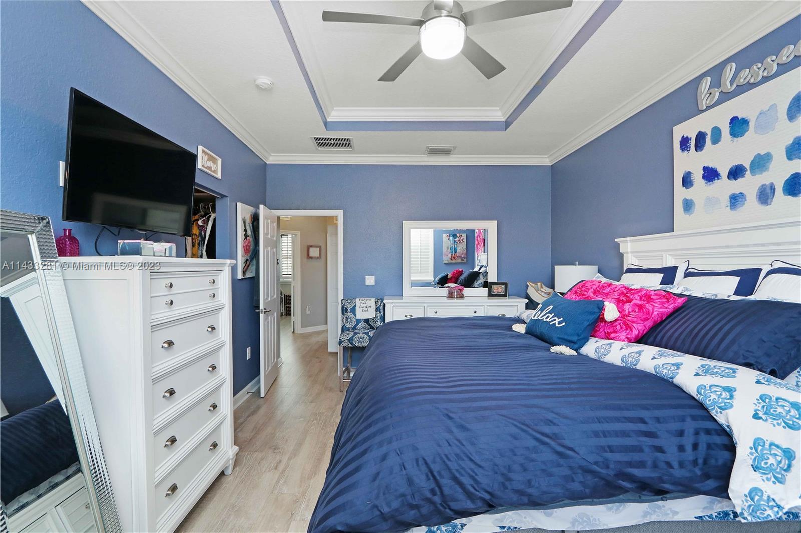 11363 Southwest 240th Street Homestead, FL 33032 - Photo 16 of 39 a living room with furniture and a flat screen tv