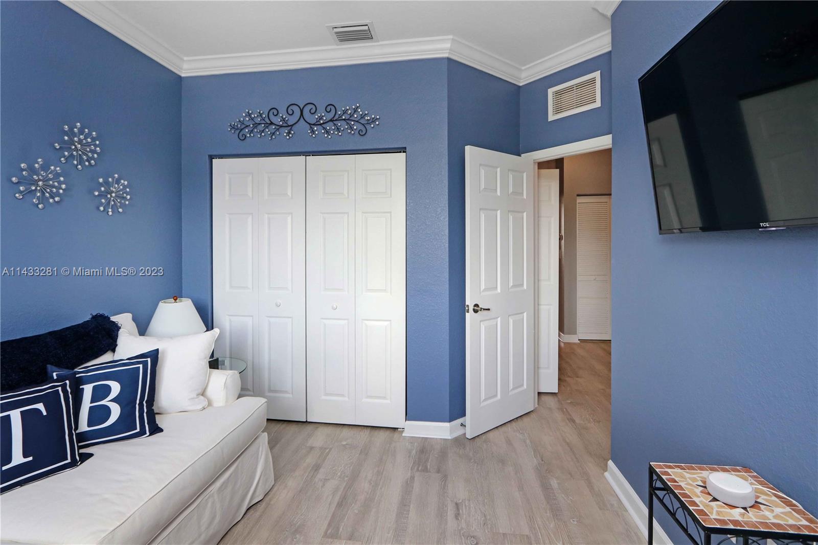 11363 Southwest 240th Street Homestead, FL 33032 - Photo 20 of 39 a living room with furniture and a wooden floor