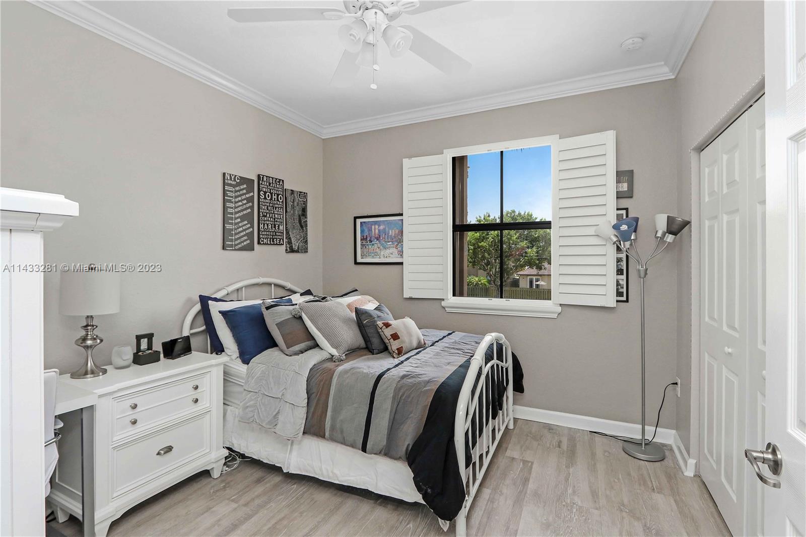 11363 Southwest 240th Street Homestead, FL 33032 - Photo 21 of 39 a bedroom with a bed and window