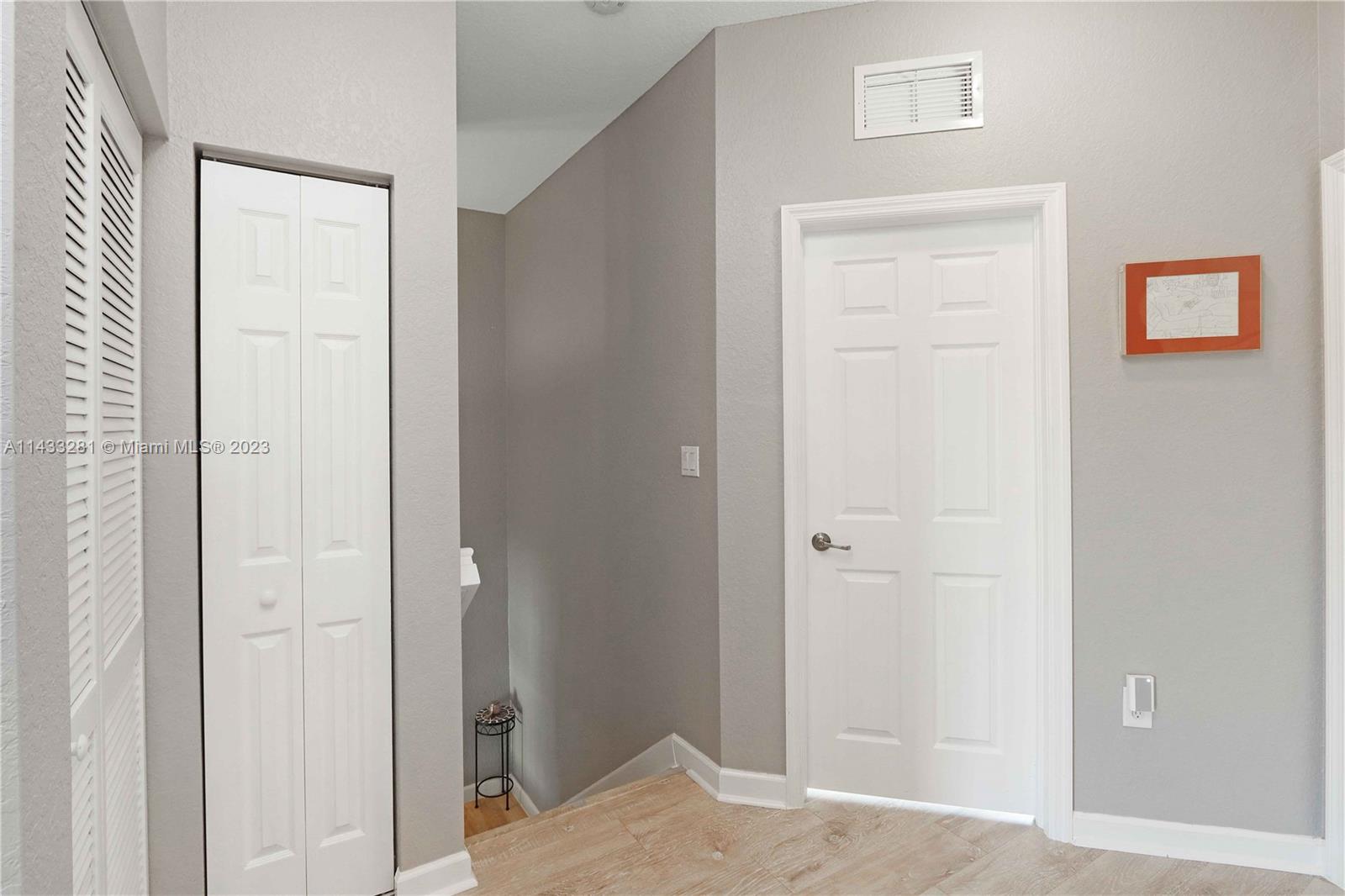 11363 Southwest 240th Street Homestead, FL 33032 - Photo 25 of 39 a view of a bedroom from the hallway