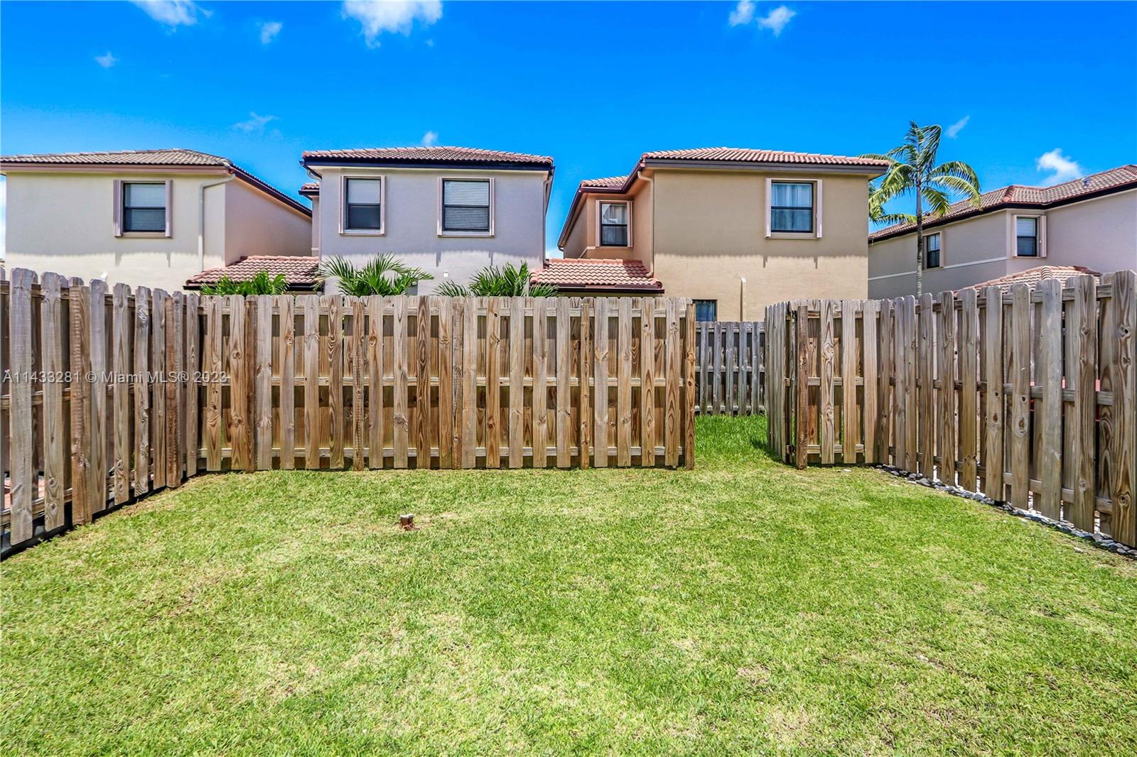 11363 Southwest 240th Street Homestead, FL 33032 - Photo 27 of 39 a front view of house with wooden fence