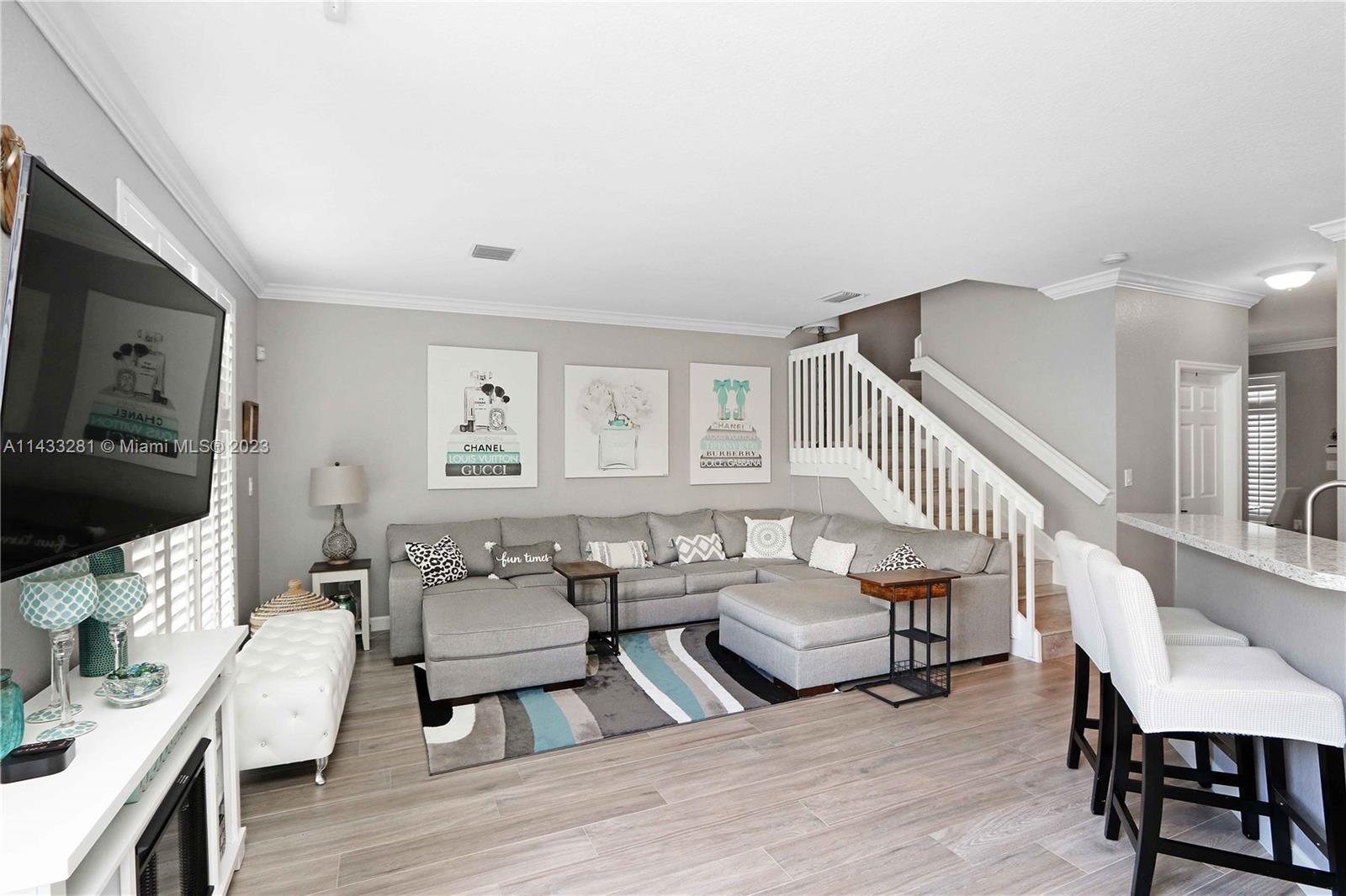 11363 Southwest 240th Street Homestead, FL 33032 - Photo 9 of 39 a living room with furniture and a flat screen tv