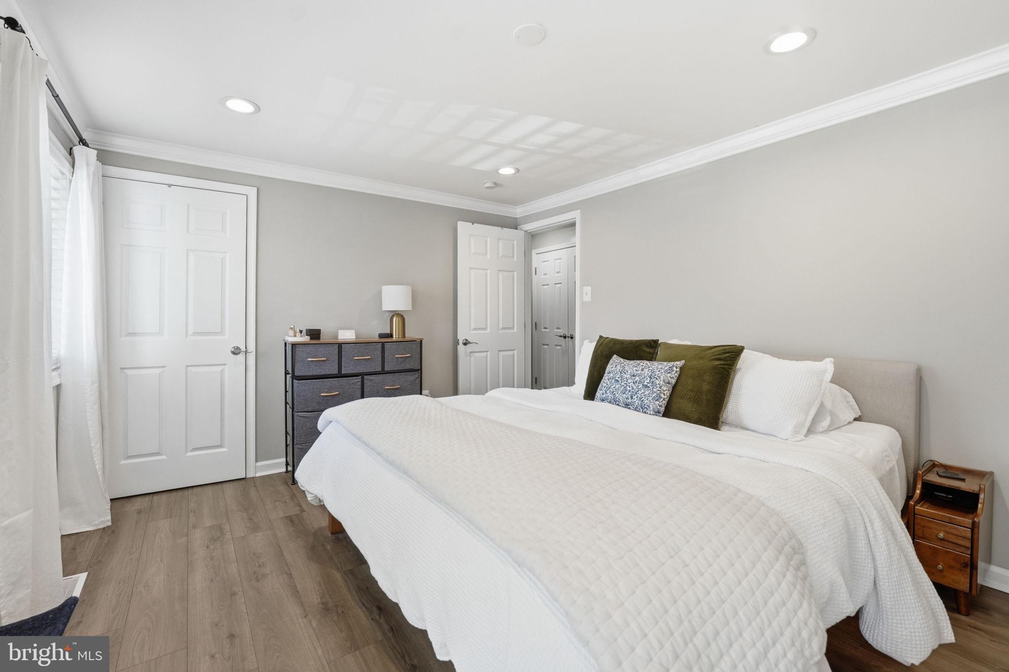 181 North Cottage Road Sterling, VA 20164 - Photo 20 of 41 a spacious bedroom with a bed and a cabinets