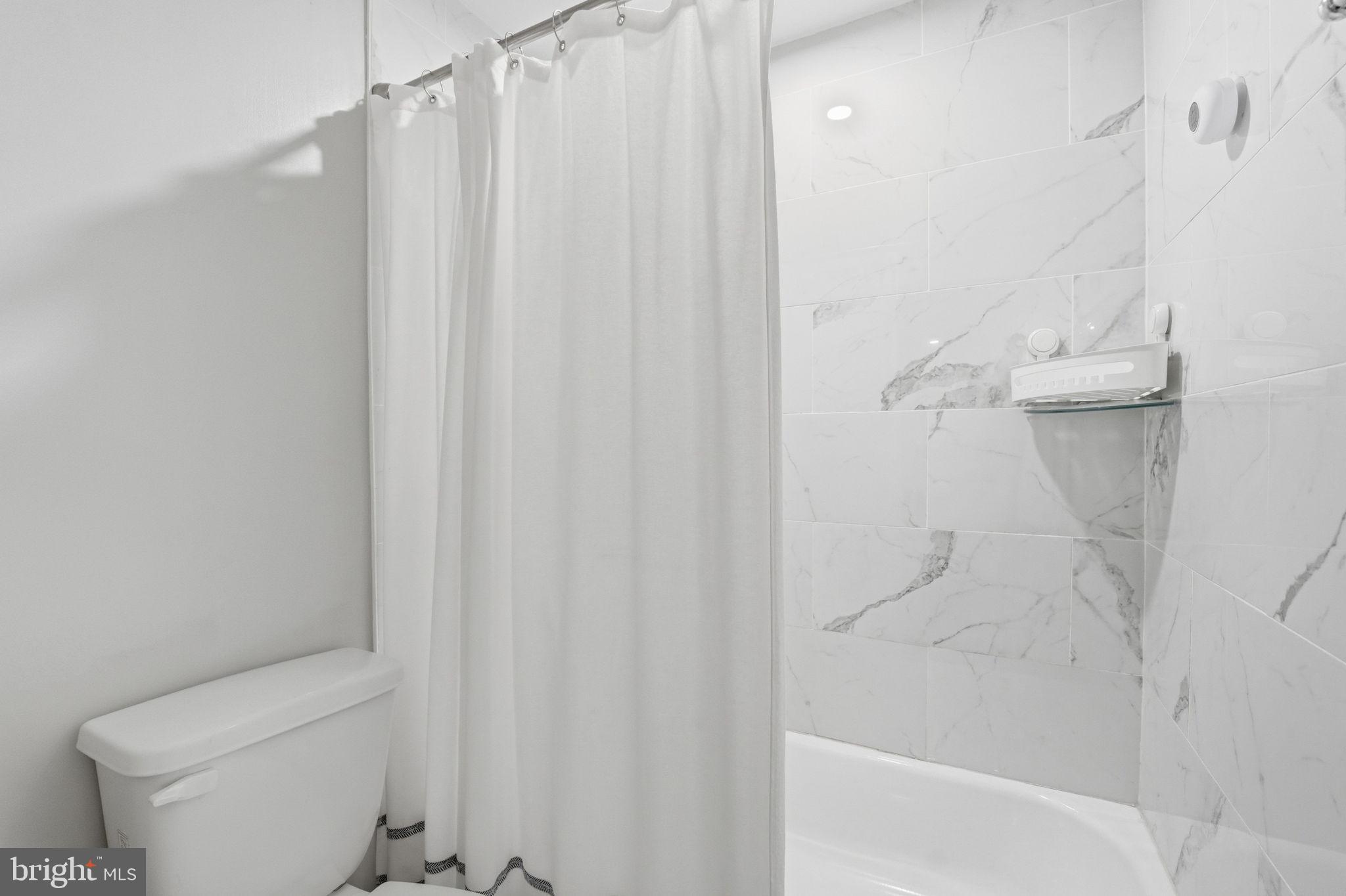 181 North Cottage Road Sterling, VA 20164 - Photo 27 of 41 a bathroom with a shower and a toilet