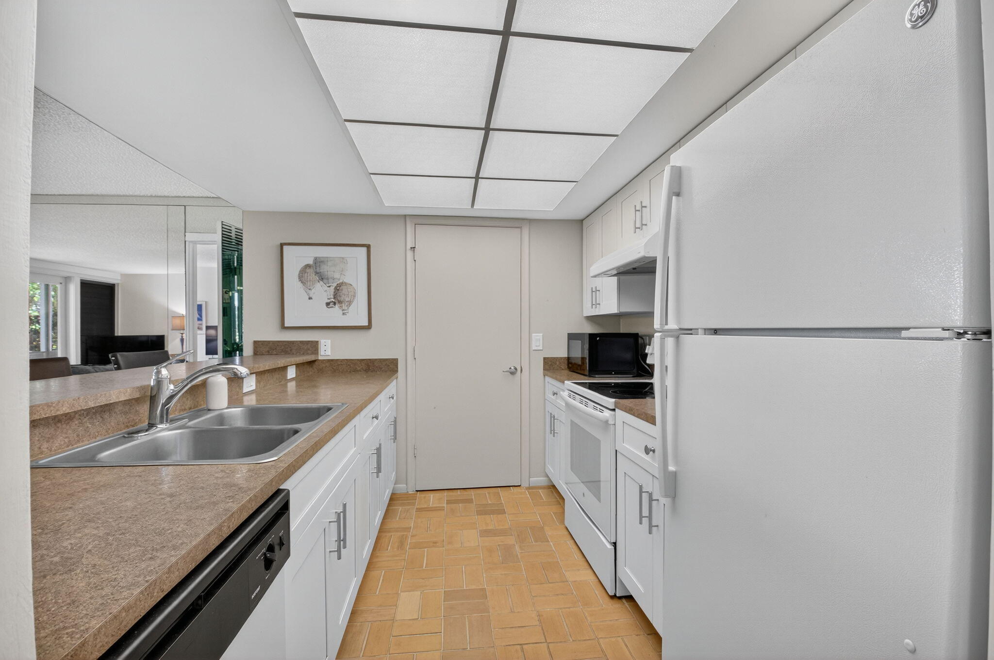 20249 Boca W Drive, Unit 2605 Boca Raton, FL 33434 - Photo 12 of 85 a kitchen with granite countertop a sink stove and refrigerator