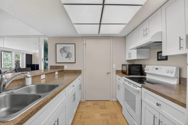 a bed room with a bed and a chair