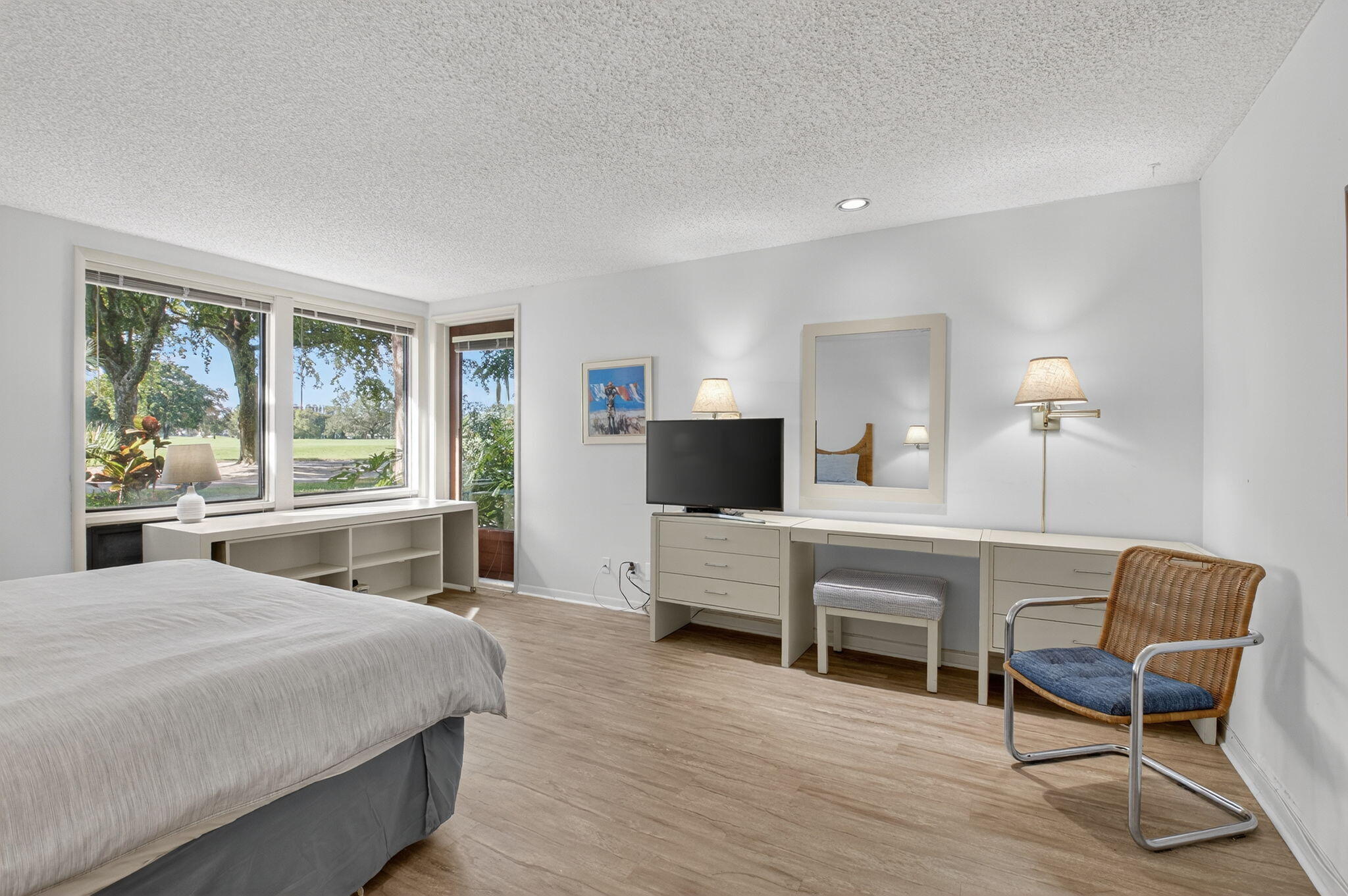 20249 Boca W Drive, Unit 2605 Boca Raton, FL 33434 - Photo 18 of 85 a bedroom with a bed and a chair