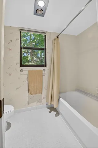 a bathroom with a double vanity sink mirror double and shower